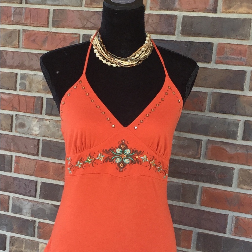 Turquoise and bead embellished top.